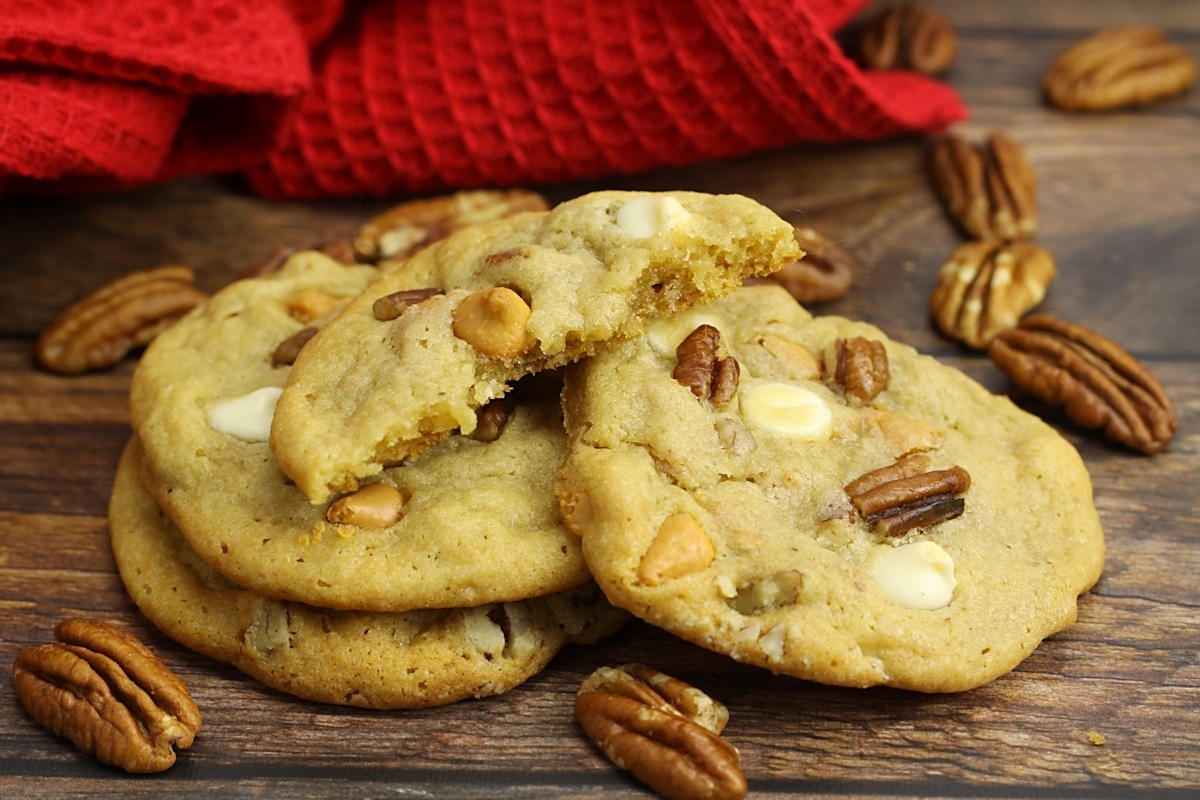 Half of a cookie on a stack of cookies.