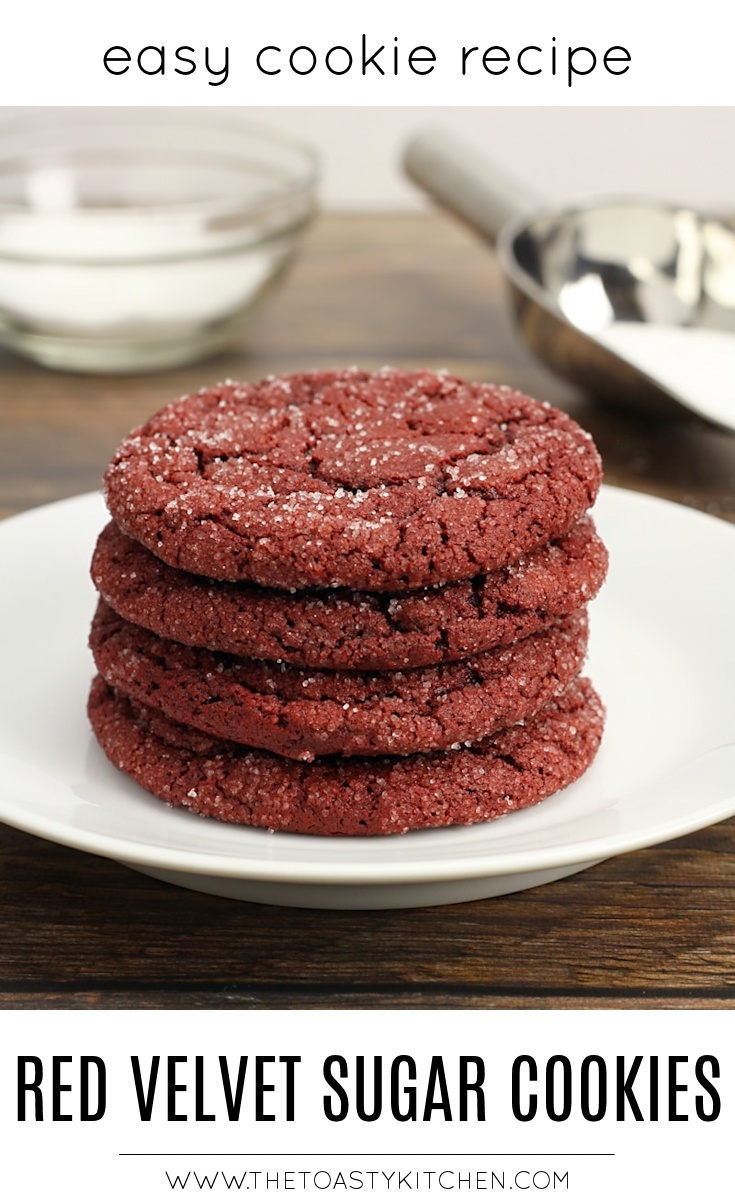 Red velvet sugar cookie stacked on a white plate.