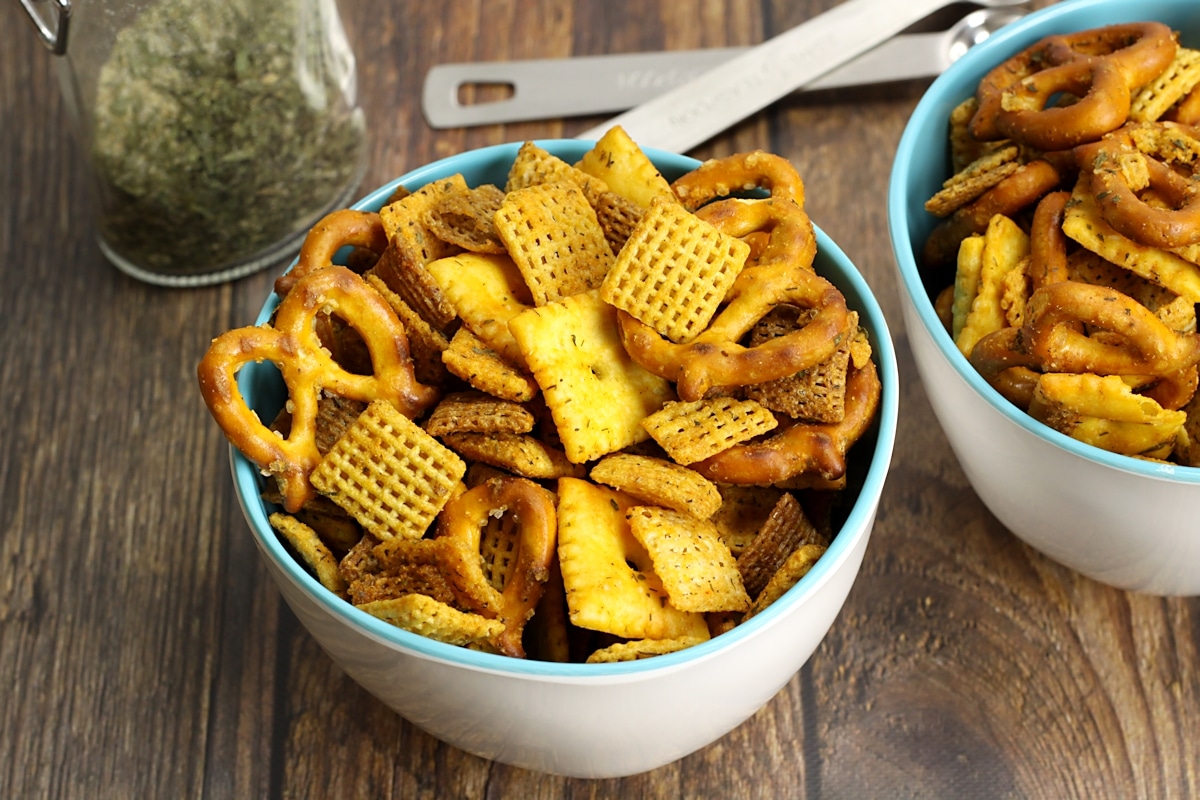 Single serve bowls filled with chex mix.