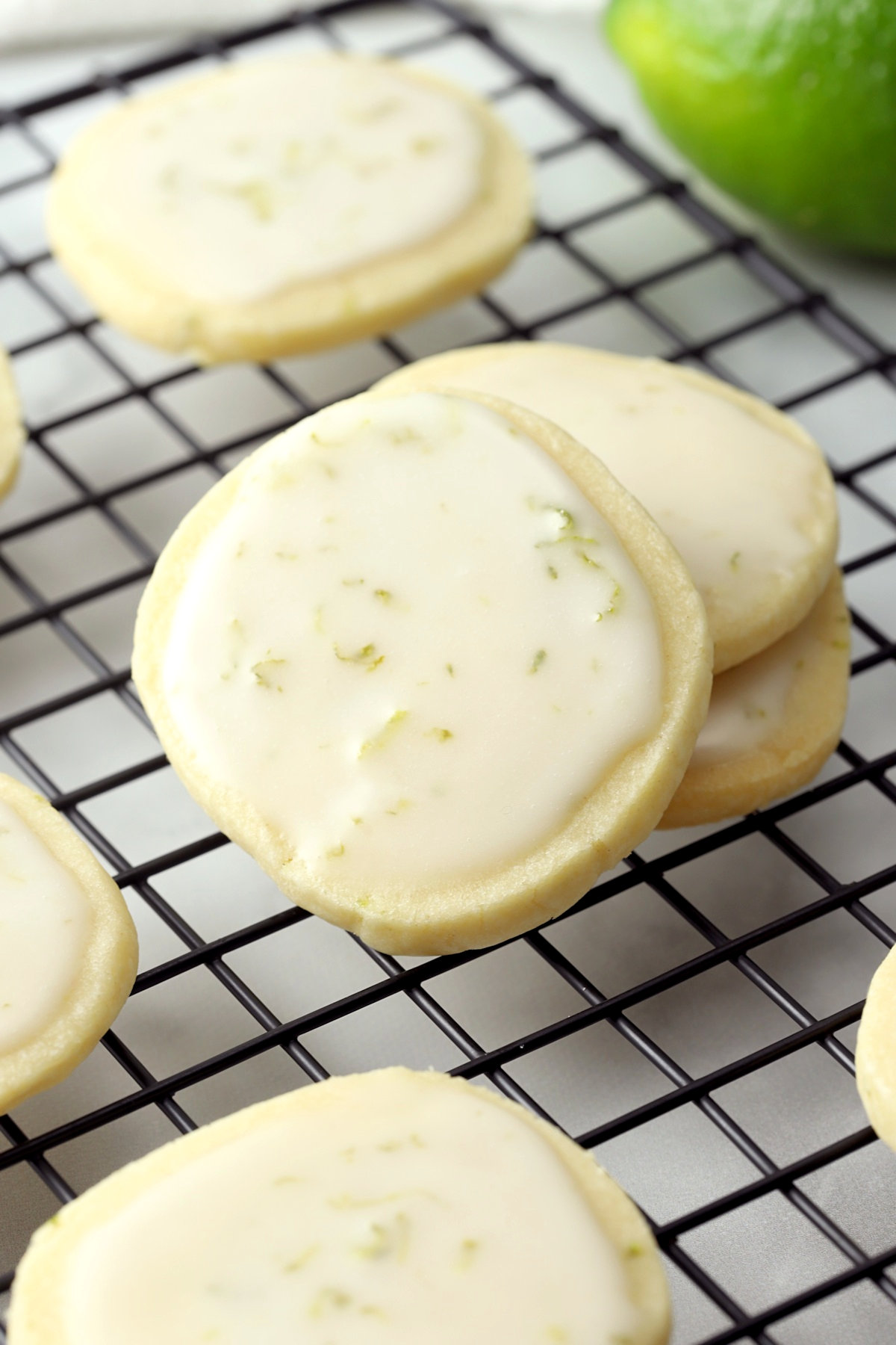 Lime zest in the icing of a cookie.