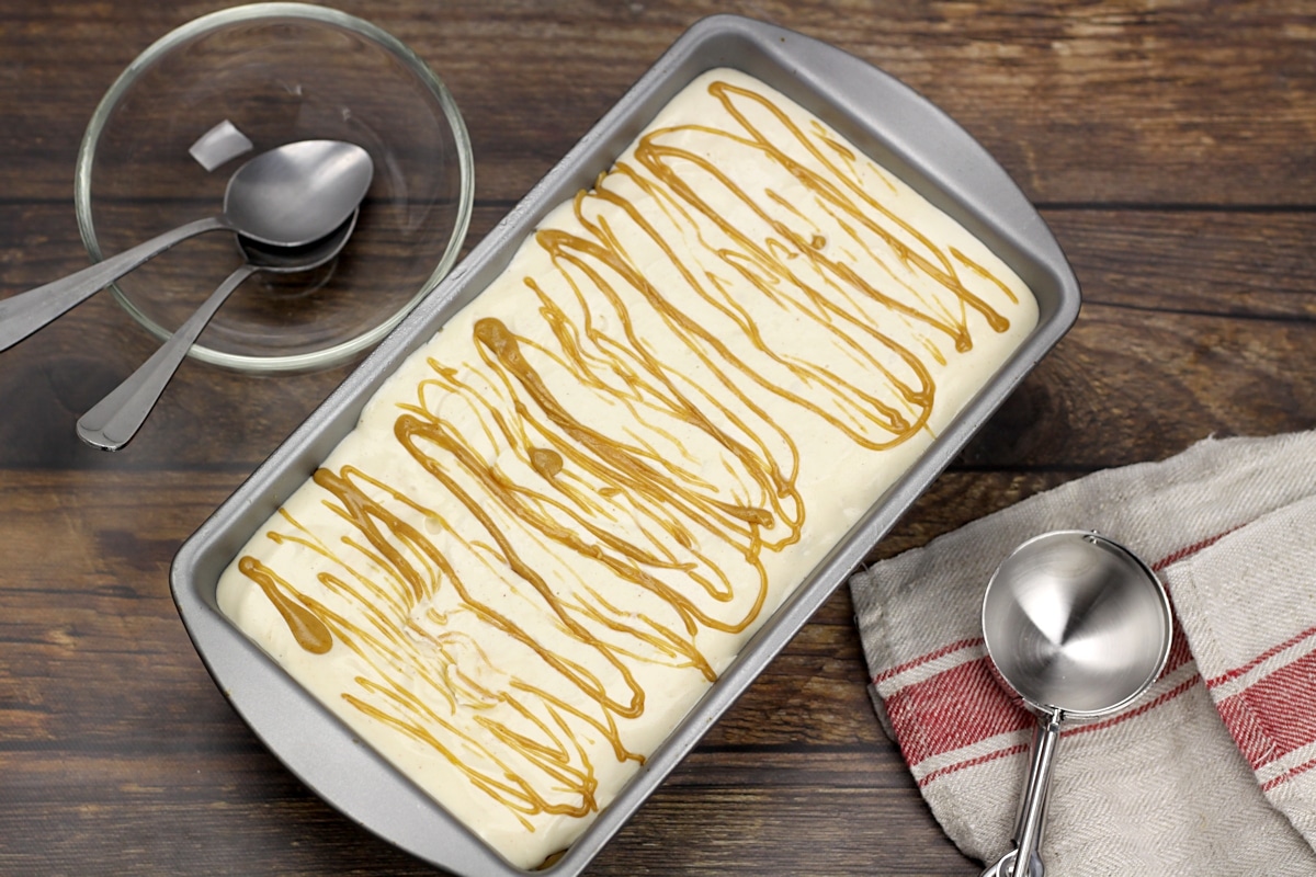 A loaf pan filled with ice cream.