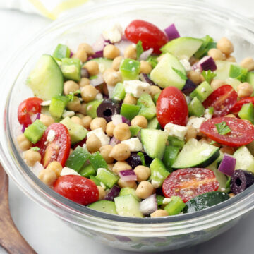 Chickpea salad with cucumbers, olives, and tomatoes.