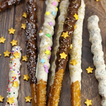 Magic wand pretzels laying in a pile on a wood counter top.