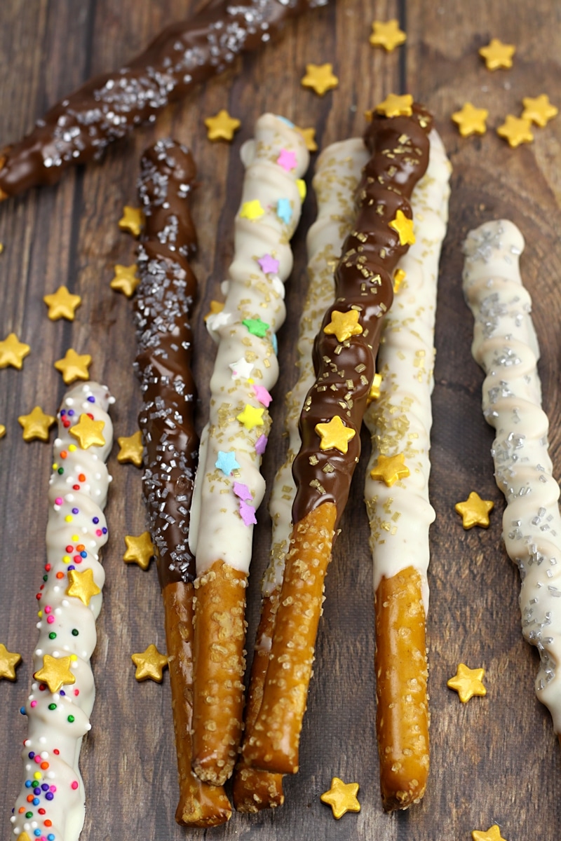 Magic wand pretzels laying in a pile on a wood counter top.