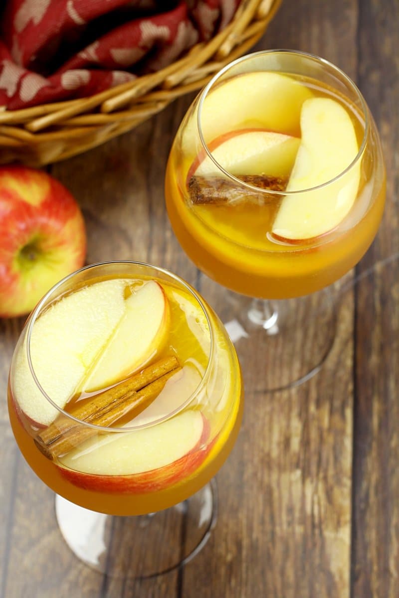 Two wine glasses filled with fall sangria.