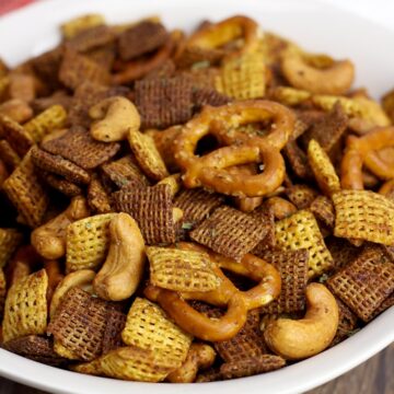 Chex cereal, pretzels, and cashews in a snack mix.