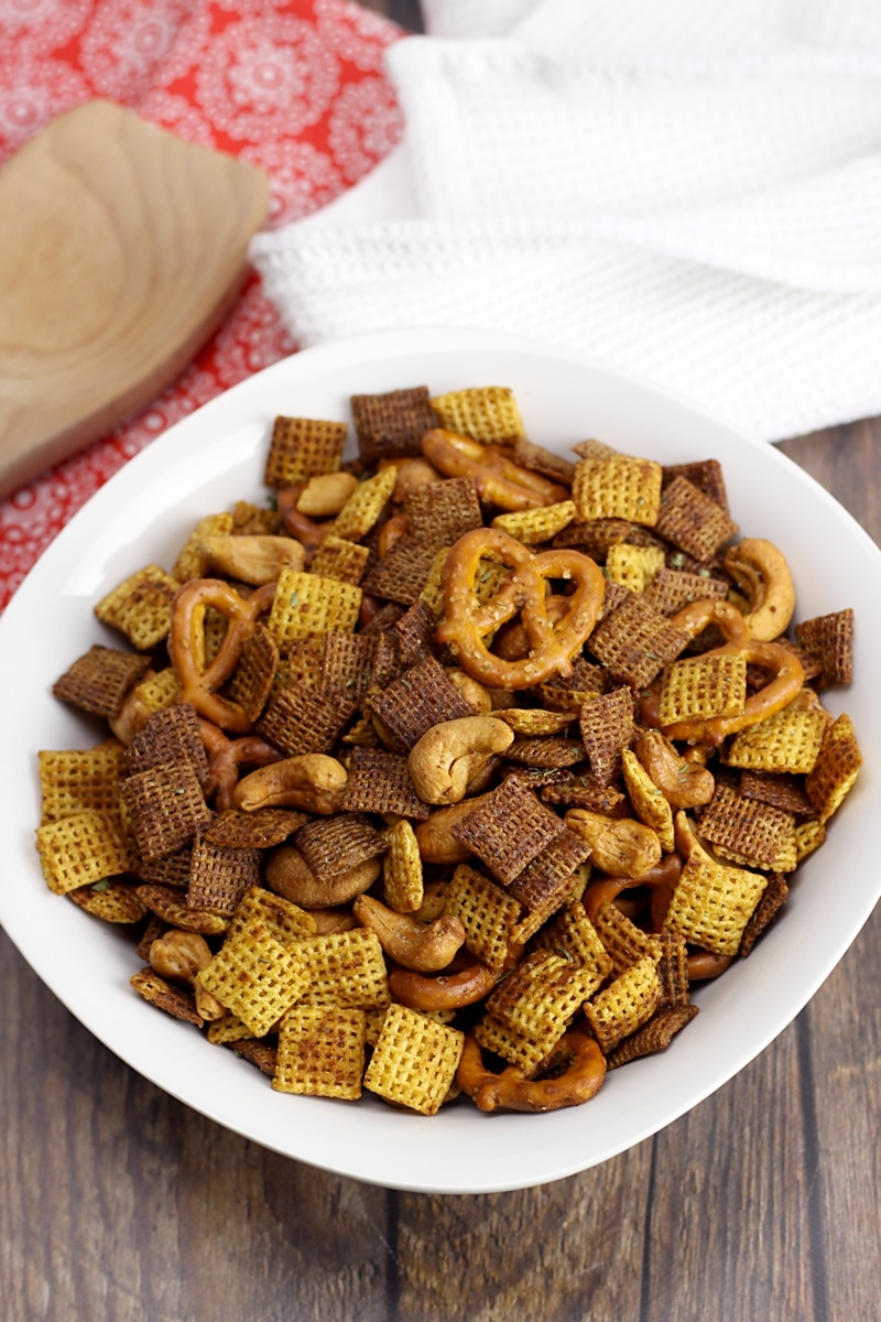 White bowl filled with chex mix.