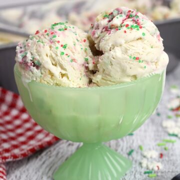 A green serving bowl filled with Christmas cookie ice cream.