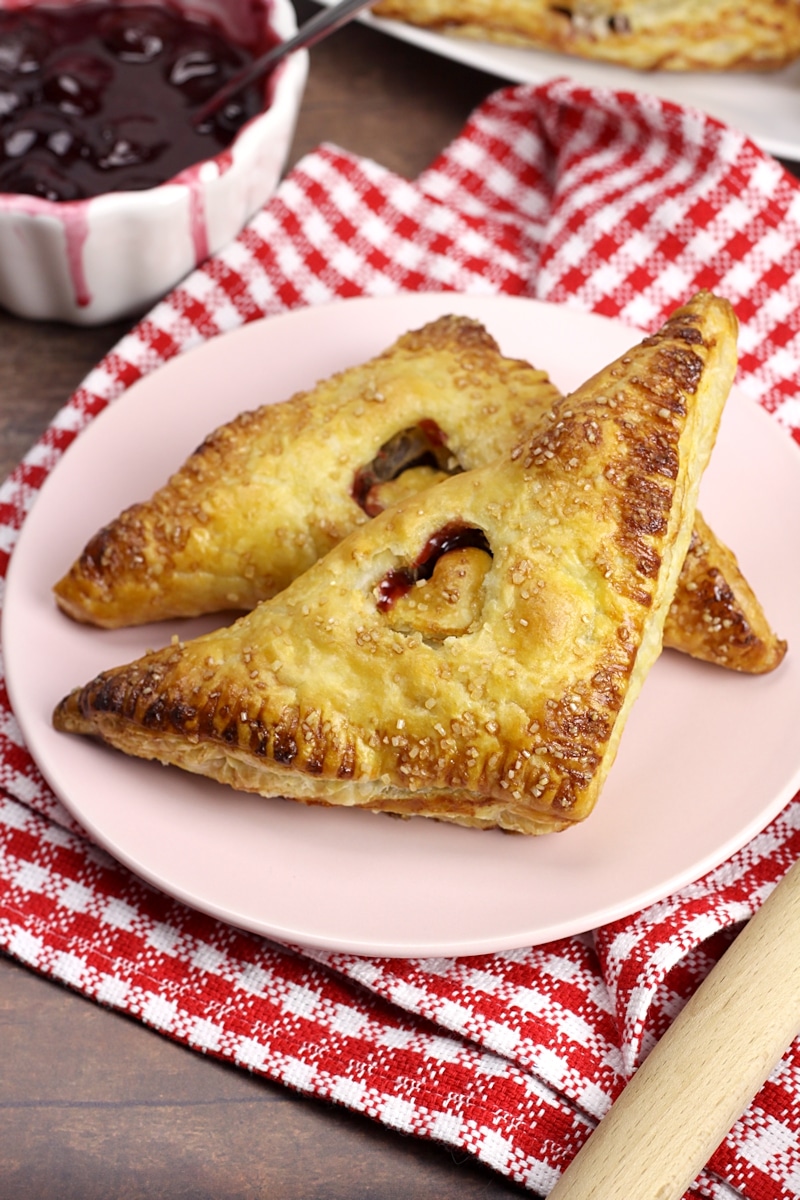 Puff pastry turnover with a small heart cutout in the center.