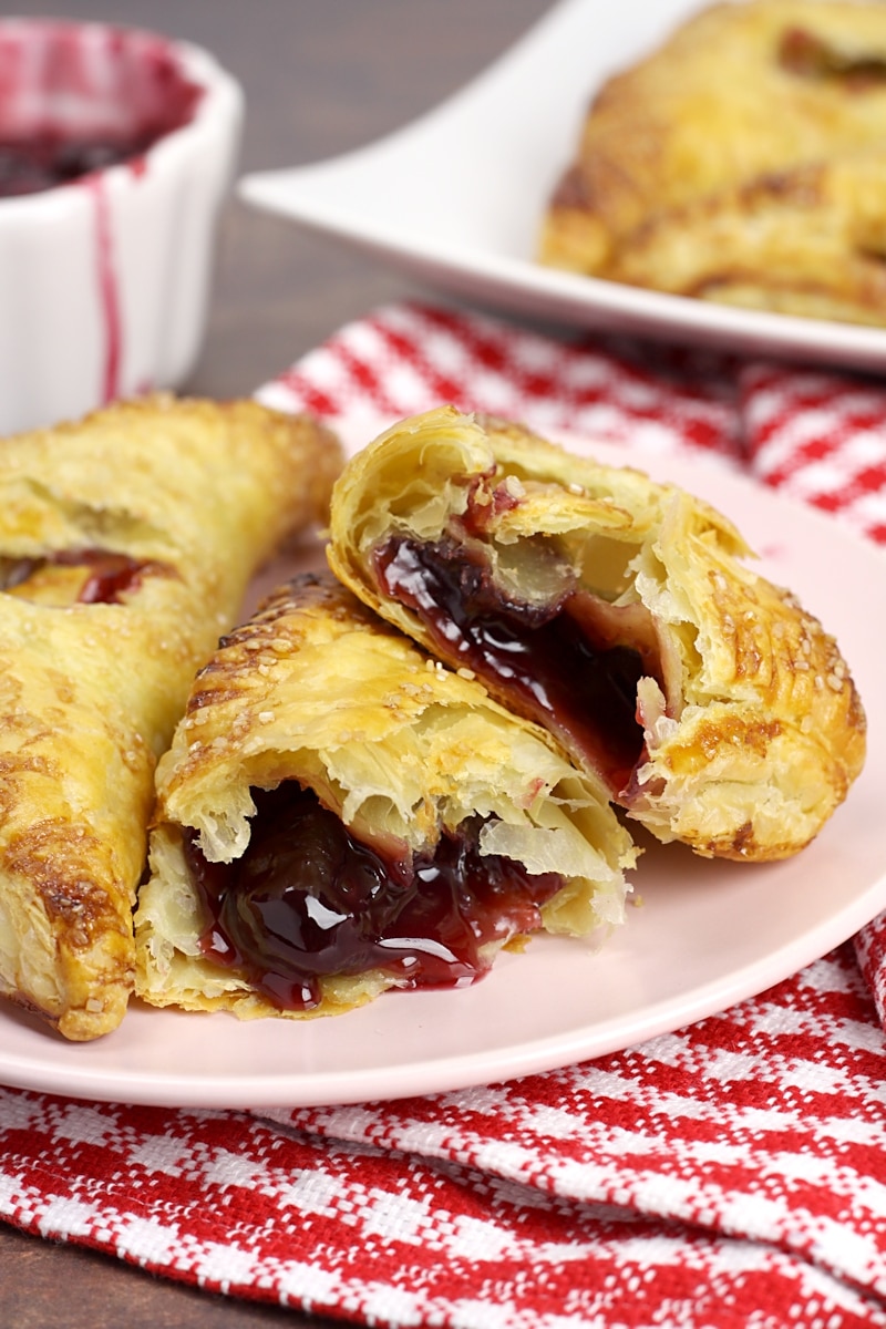 Turnover sliced in half to show cherry filling.