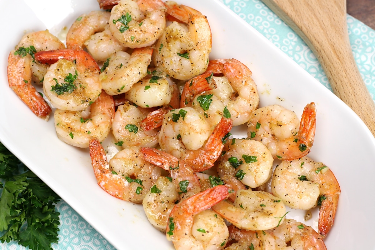 Shrimp topped with chopped parsley.