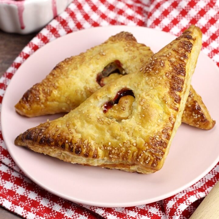 Puff pastry turnover with a small heart cutout in the center.