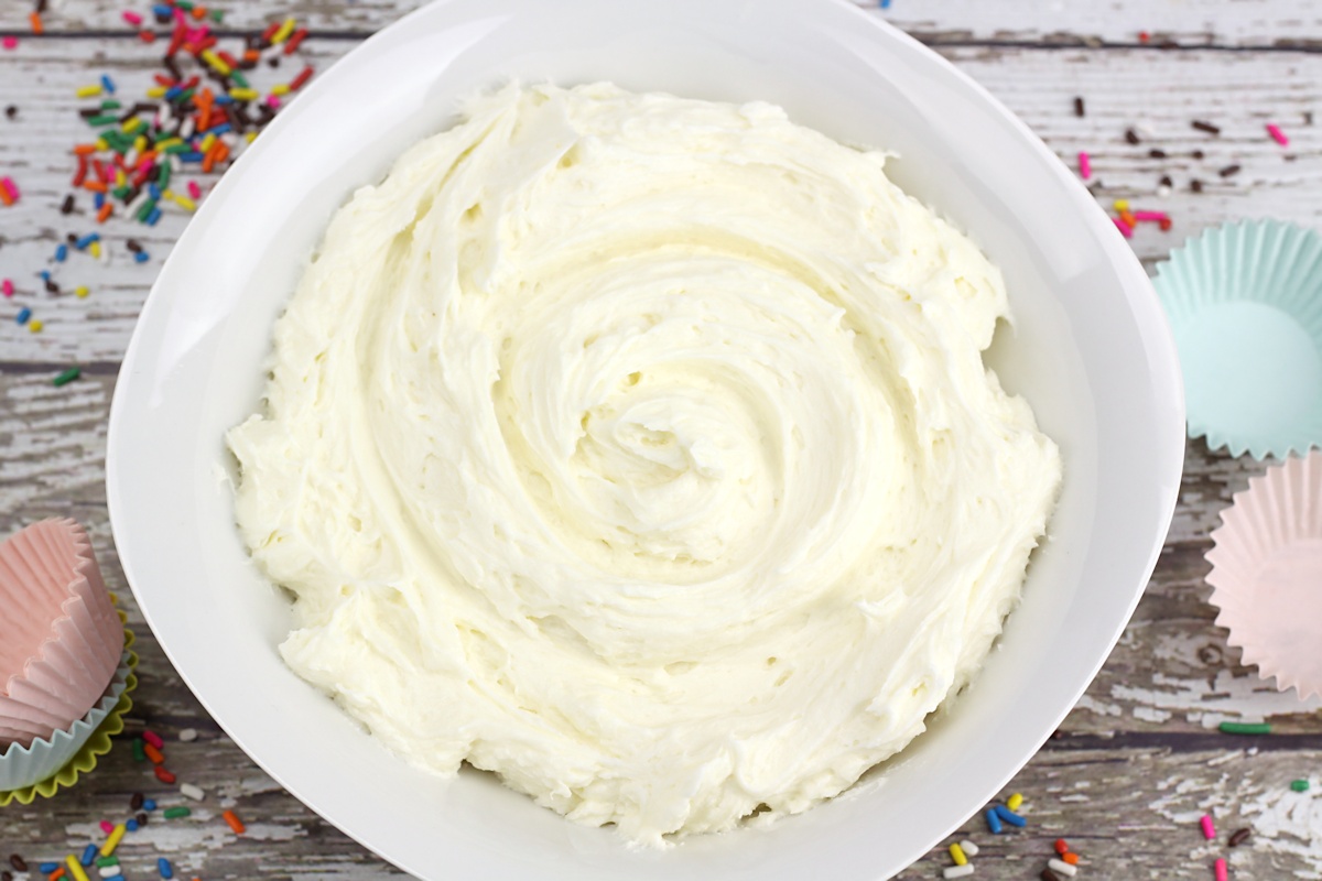A white bowl filled with frosting.