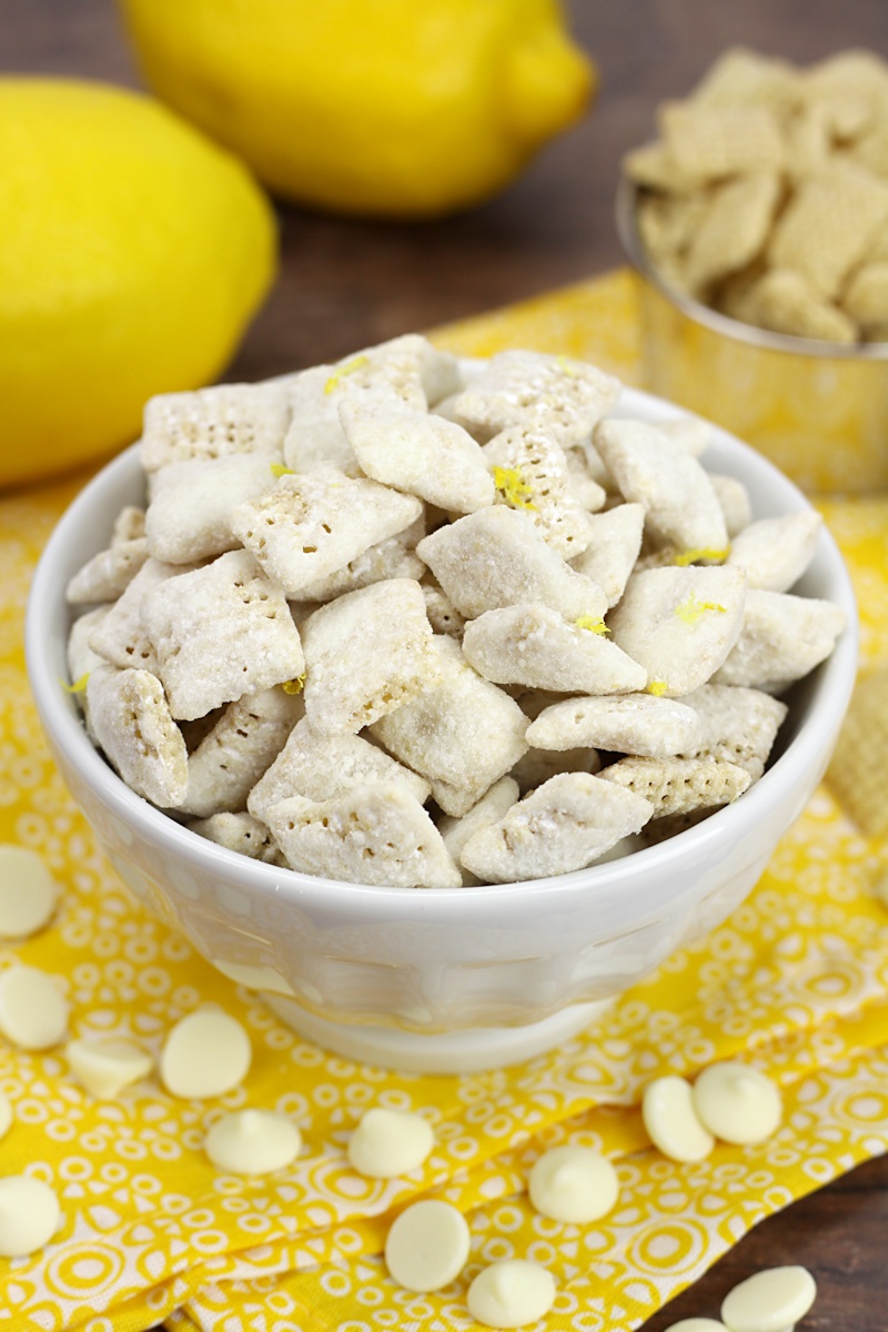 A decorative white bowl filled with lemon puppy chow.