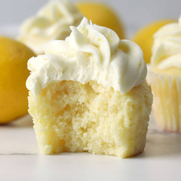 Lemon cupcake with a bite missing.