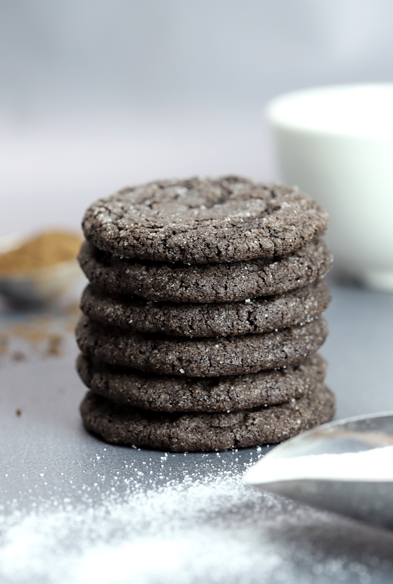 A stack of chocolate cookies on a grey counter top