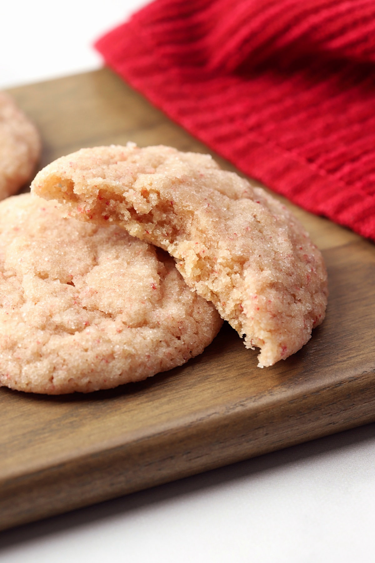 A strawberry cookie torn in half.