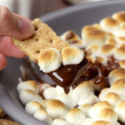 A graham cracker dipped into chocolate and melted marshmallows.