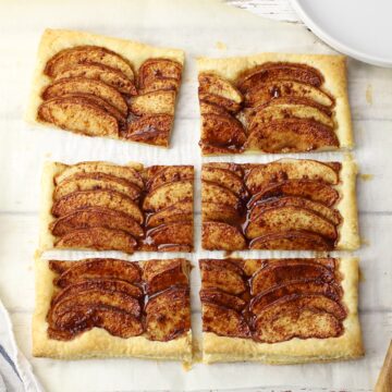 Puff pastry apple tart sliced into six pieces.