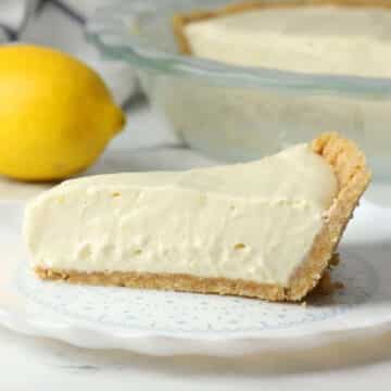 Slice of lemon piebox pie on a serving plate.