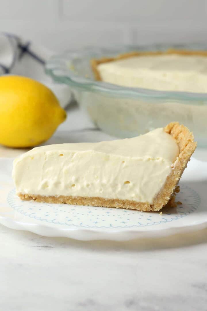 Slice of lemon piebox pie on a serving plate.