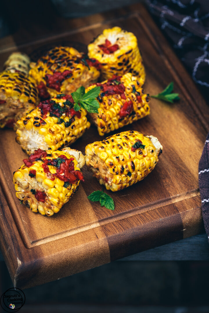 Barbecued Sweetcorn with Roasted Pepper, Honey and Sumac Salsa Dressing