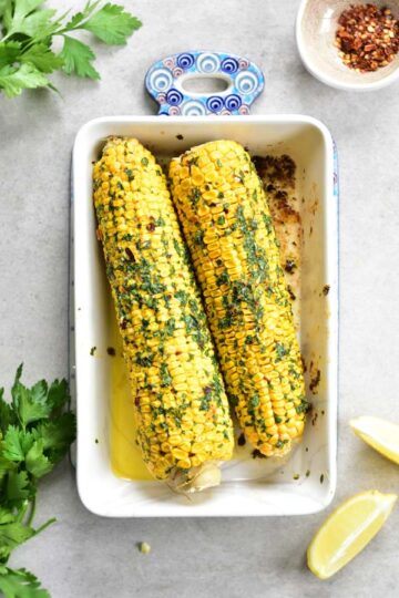 Oven-roasted corn on the cob with herb and chili butter