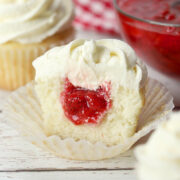Strawberry filled cupcake sliced in half.