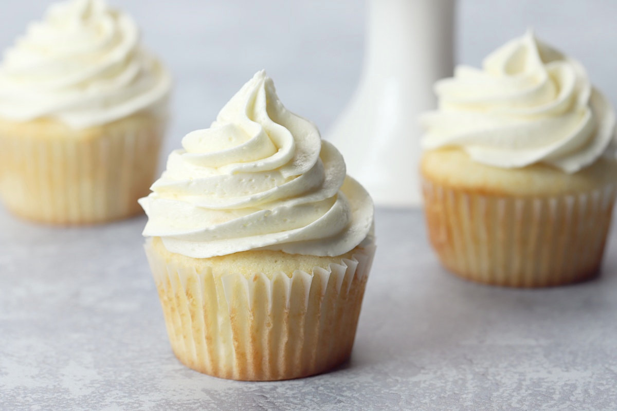 Cupcakes topped with whipped buttercream frosting.
