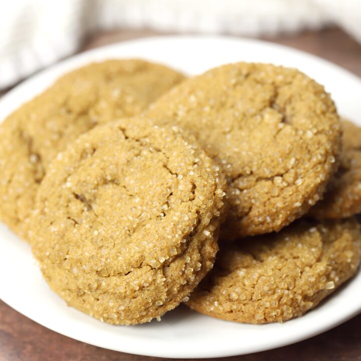 White plate filled with molasses cookies.