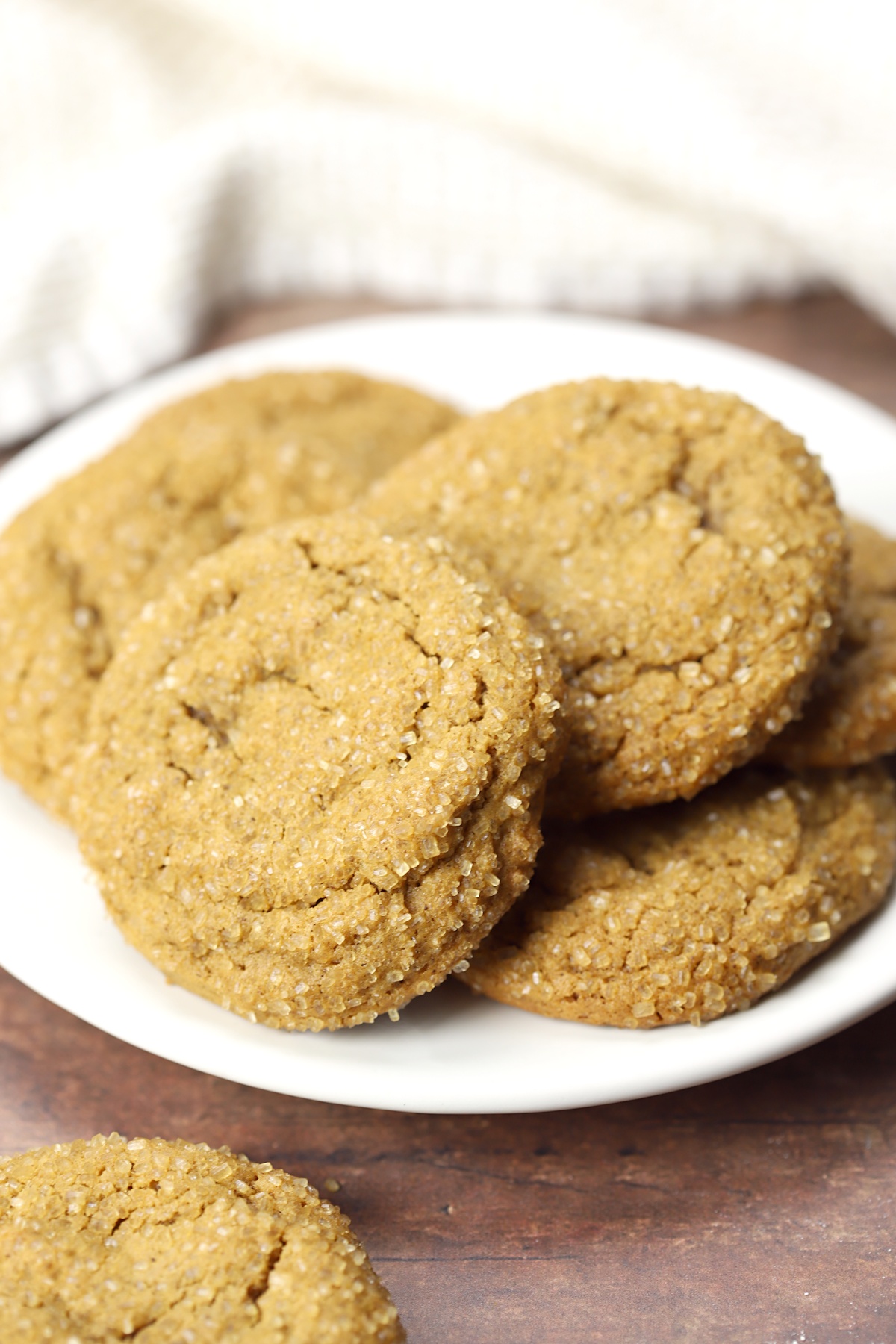 White plate filled with molasses cookies.