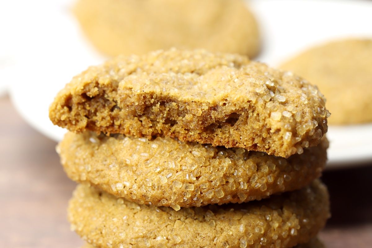 Half of a molasses cookie, revealing a moist center.