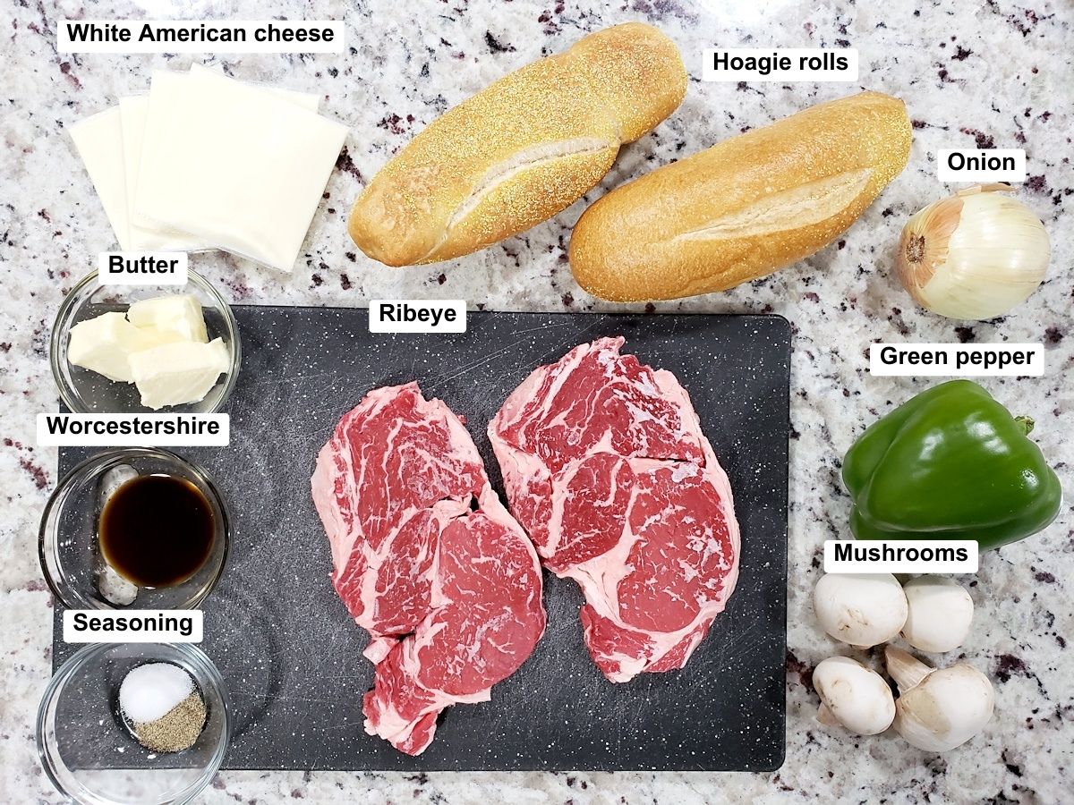 Ingredients for a cheesesteak on a counter top.