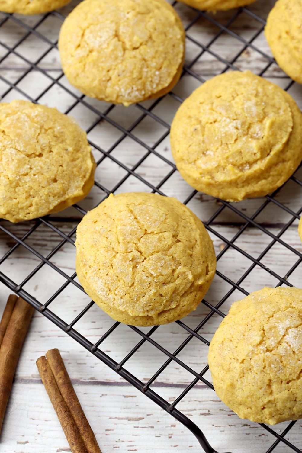 Sugar cookies on a cooling rack.