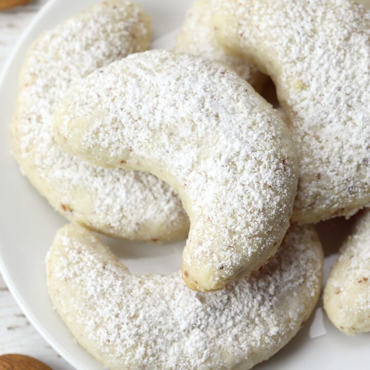 Vanillekipferl vanilla crescent cookies on a serving plate.