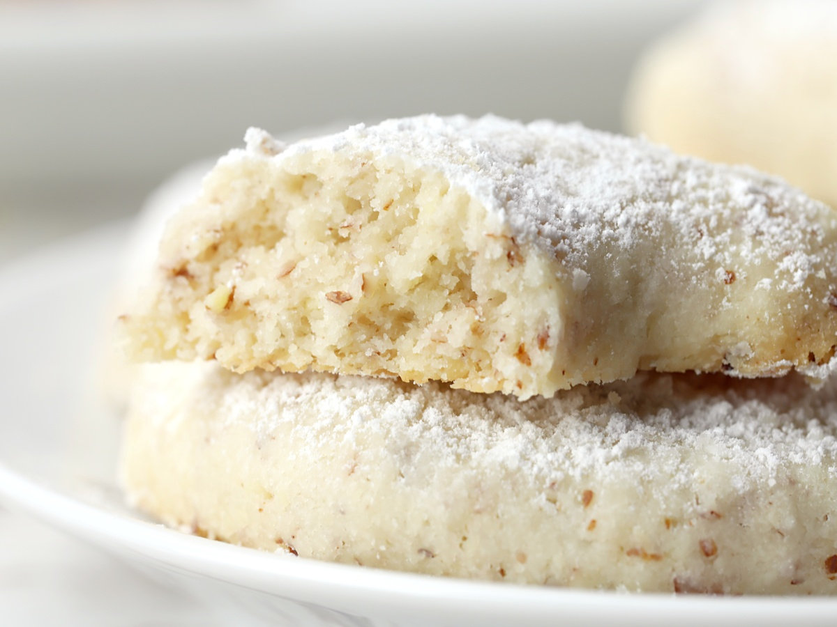 View of ground almonds inside a baked vanillekipferl cookie.