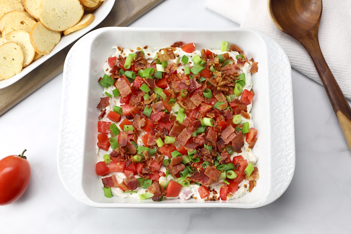A white 8x8 dish filled with BLT dip.