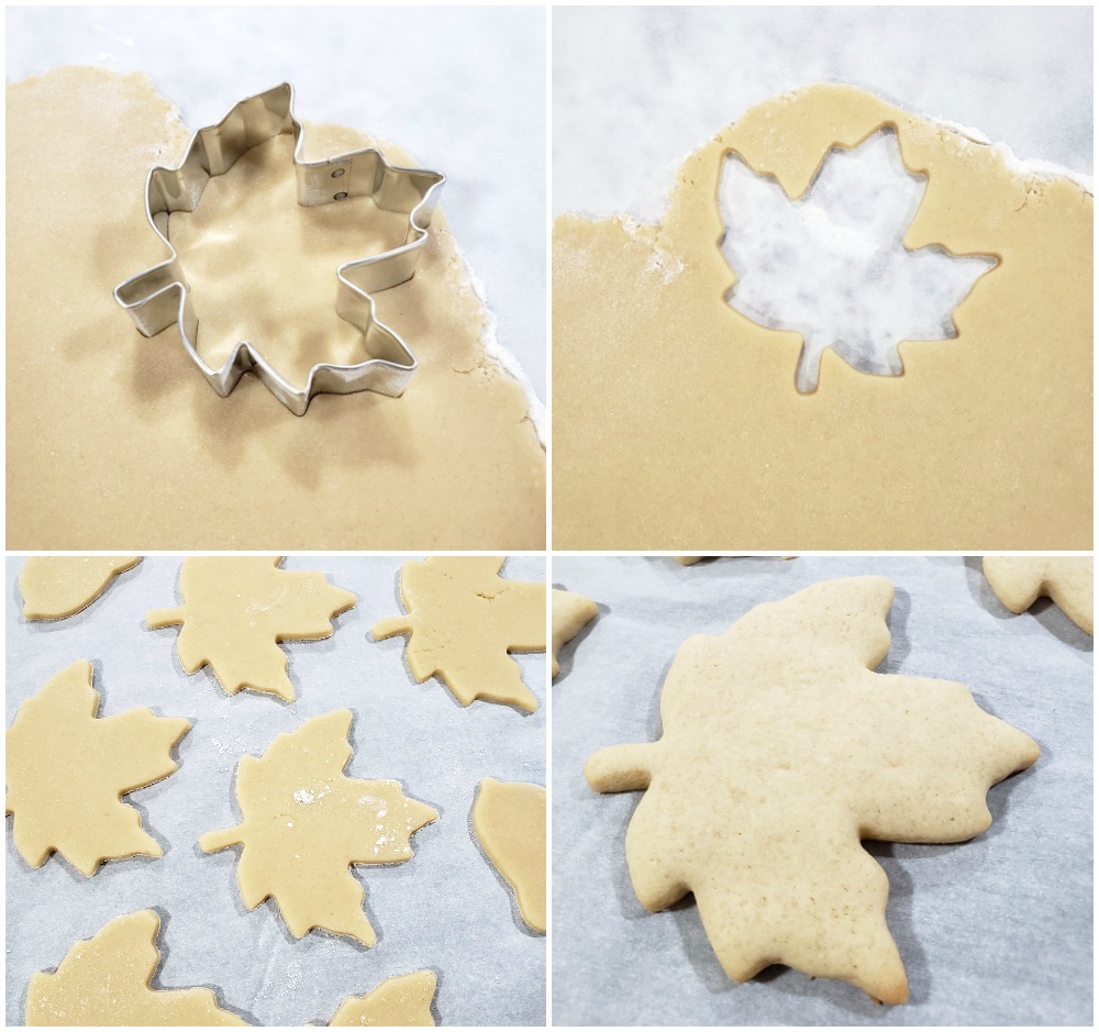 Rolling out cookie dough and cutting with a maple leaf cookie cutter.