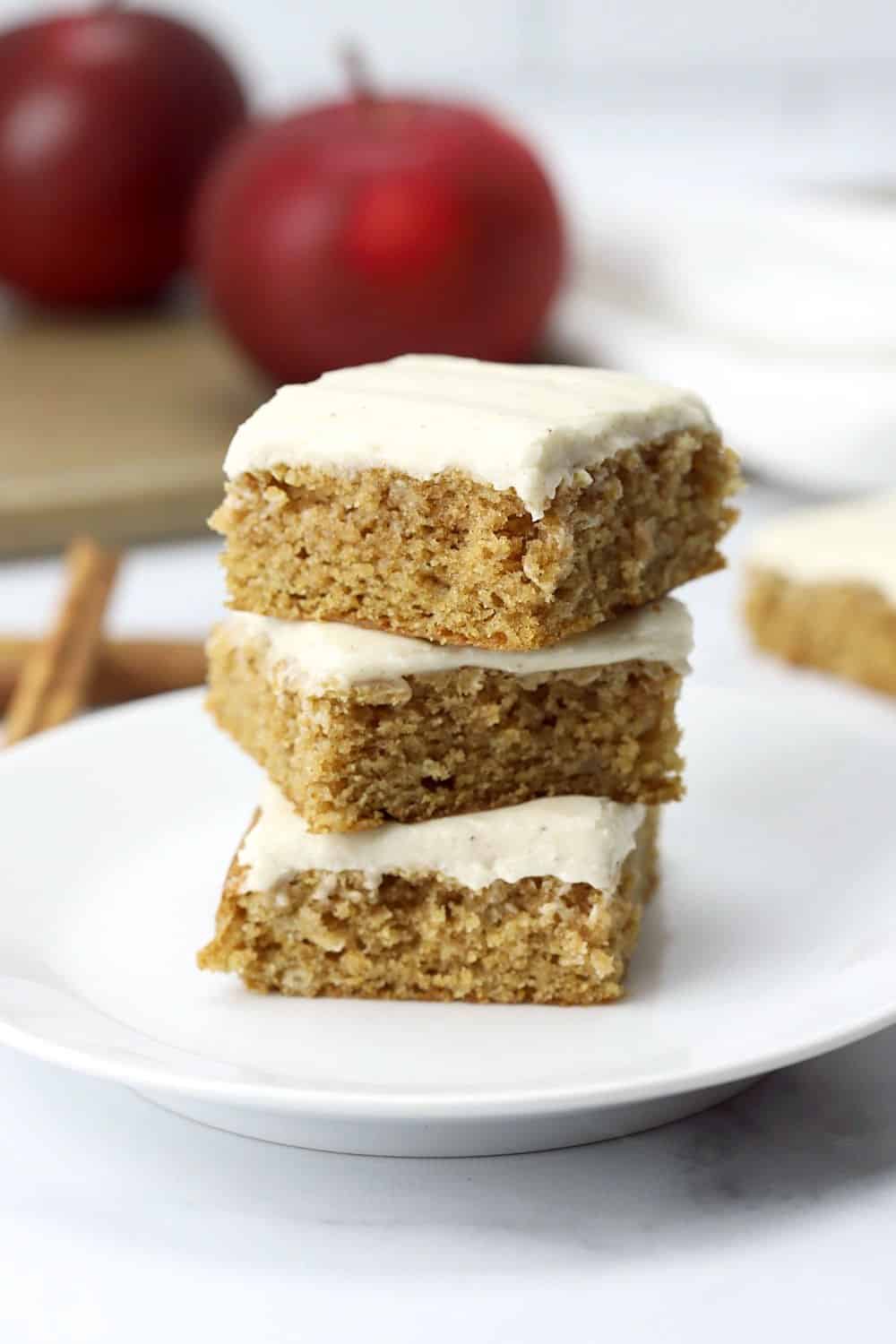Stack of applesauce spice bars on a white plate.