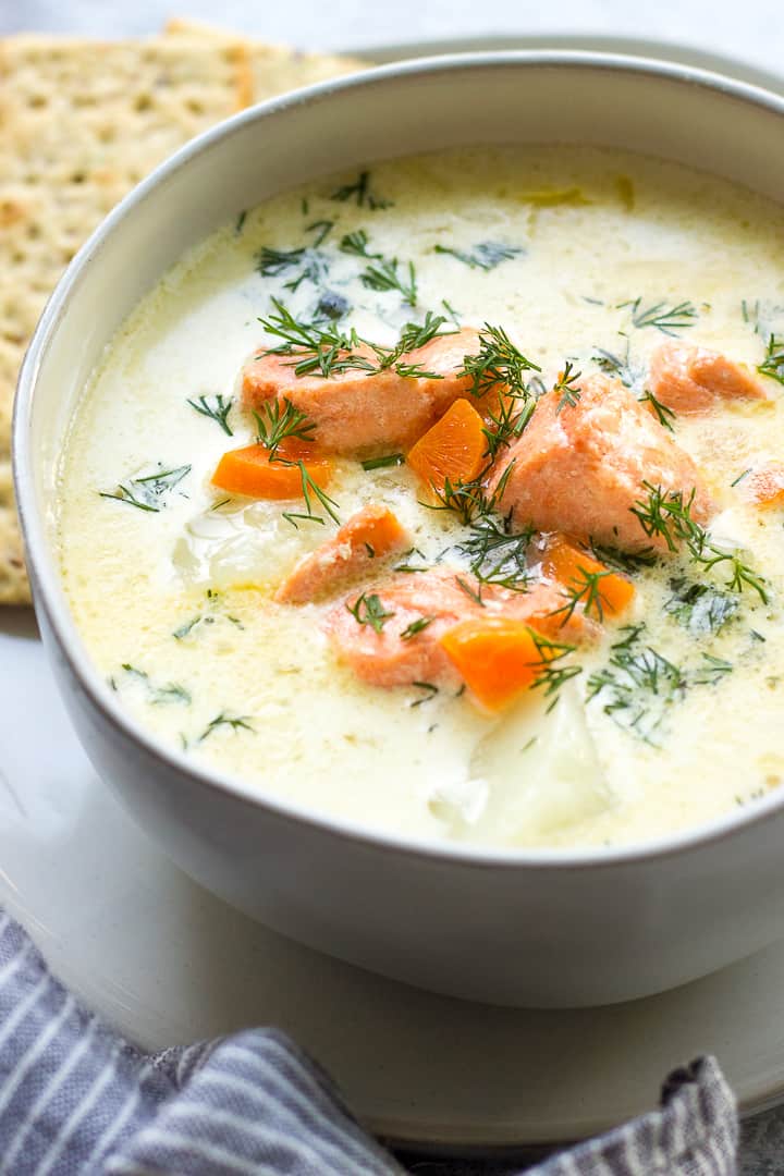 Salmon Soup in a bowl with a blue and white towel.