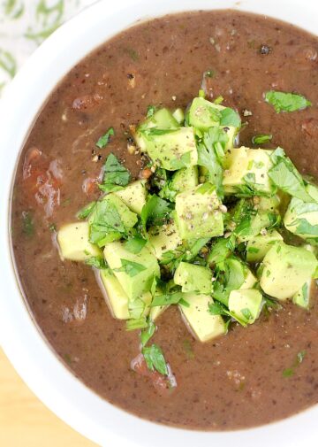 black bean soup topped with avocado.