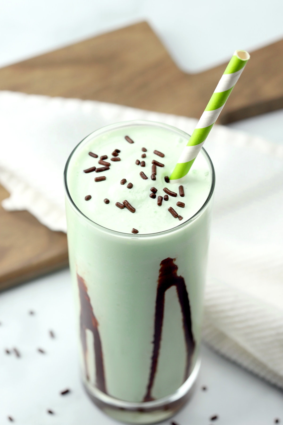 Chocolate sprinkles on top of a frozen green drink.
