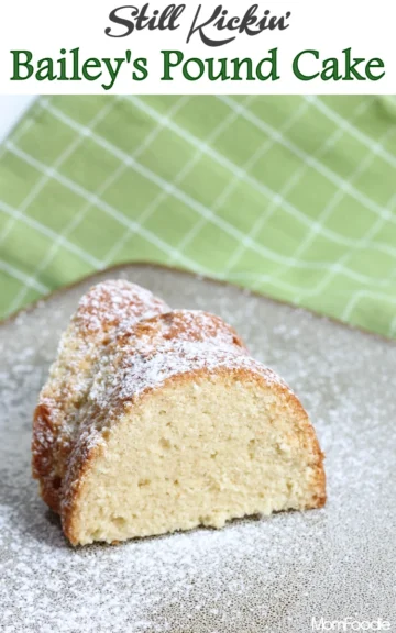 A slice of pound cake on a plate, garnished with confectioner's sugar.