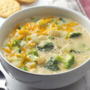 White bowl filled with broccoli potato soup.