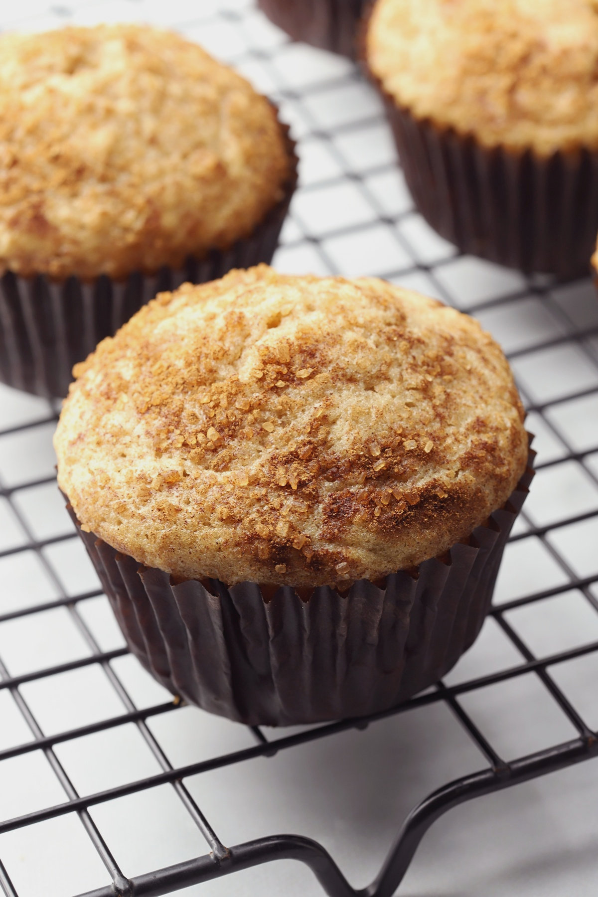 Walnut muffins on a cooling rack.