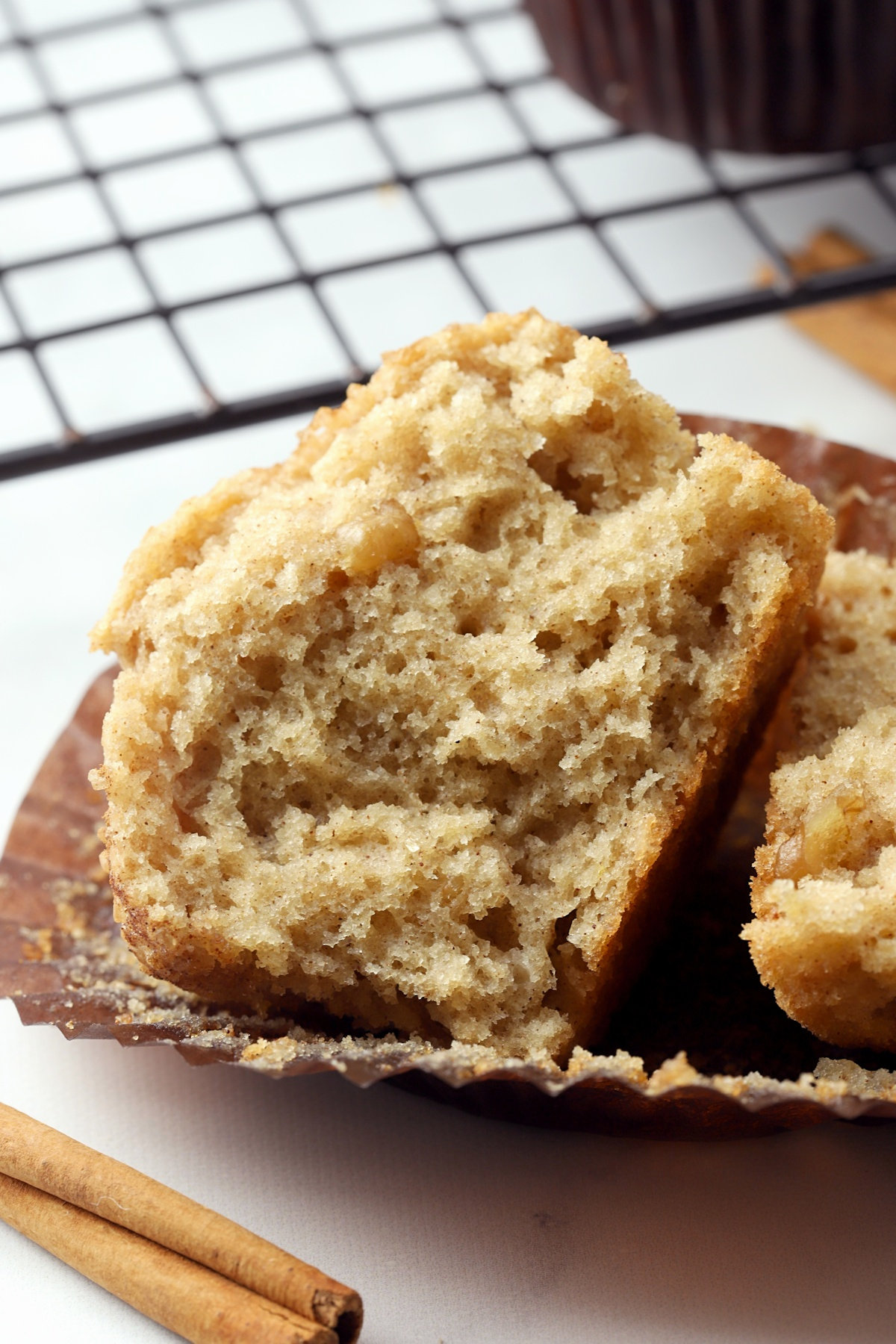 Half a muffin on a paper wrapper.