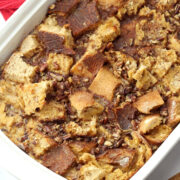 A 9x13 pan filled with bread cubes and pecans.