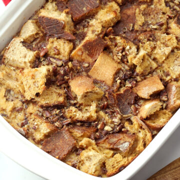 A white casserole dish filled with French toast casserole.