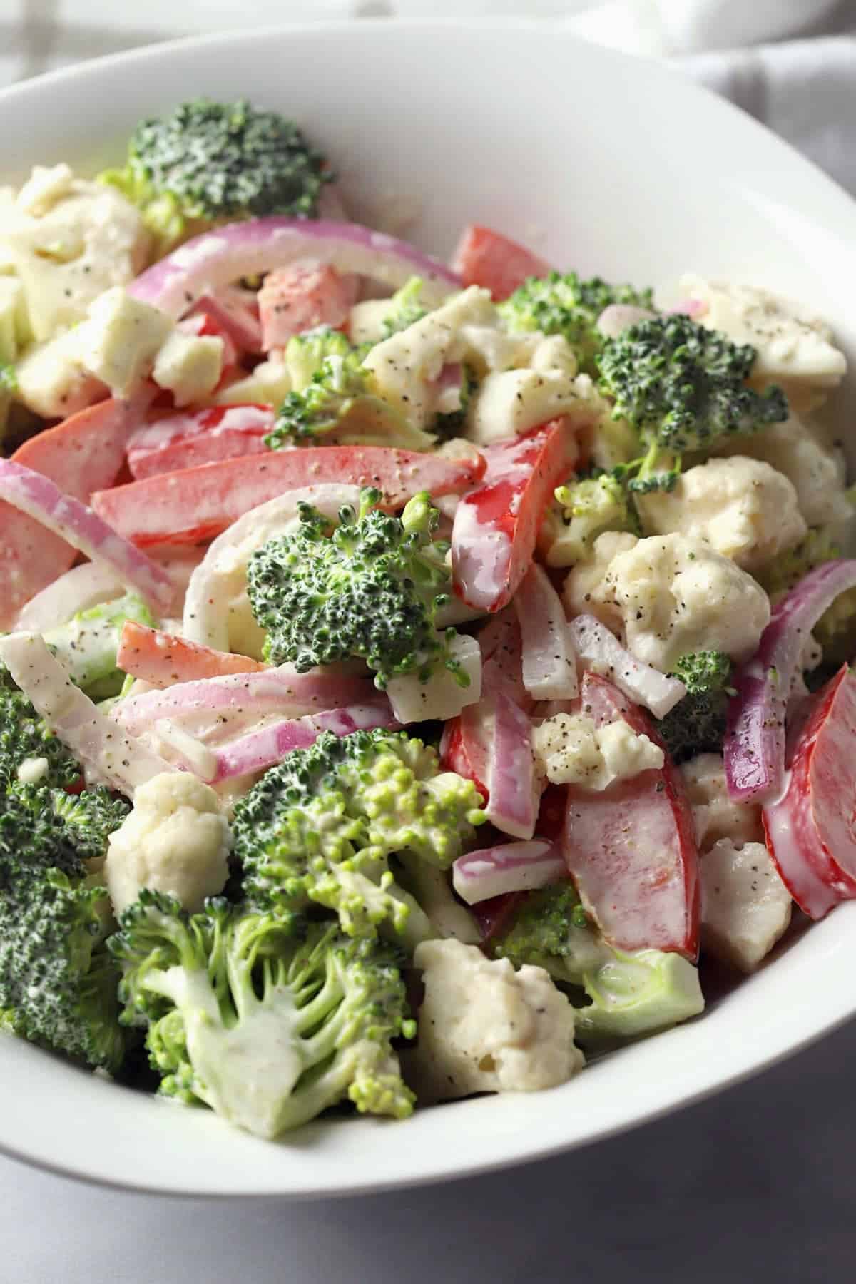 Broccoli and cauliflower tossed in dressing.