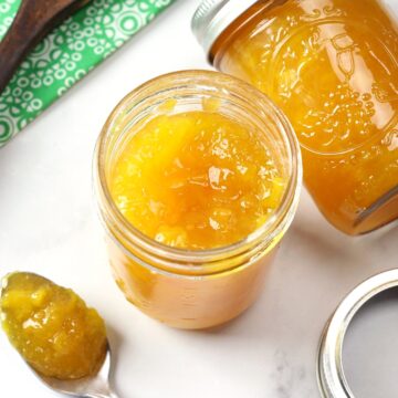 Looking into the top of a jar of peach jam.